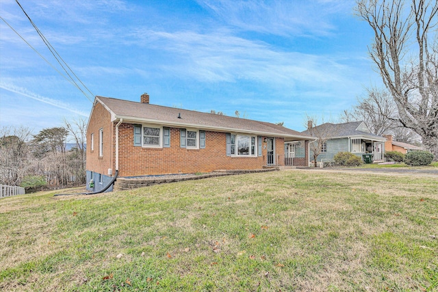 ranch-style home with a front lawn