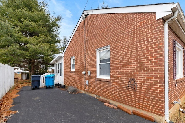 view of property exterior featuring a patio area