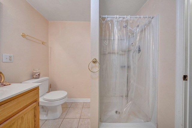 bathroom featuring tile patterned floors, walk in shower, vanity, and toilet