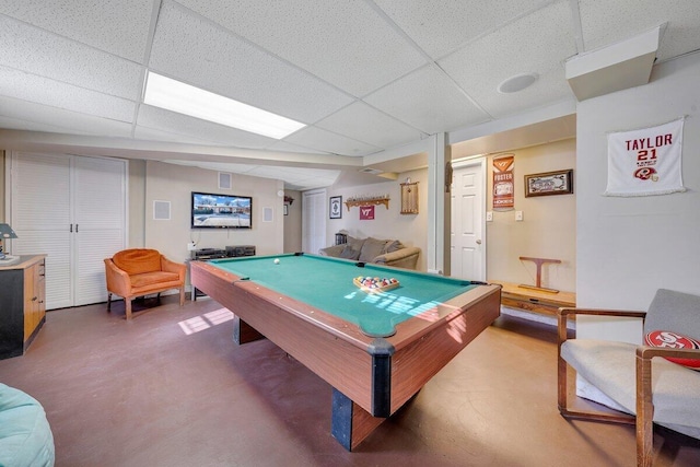 recreation room featuring a paneled ceiling, concrete floors, and pool table