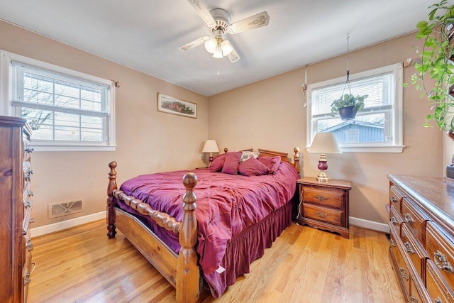 bedroom with light wood-type flooring and ceiling fan