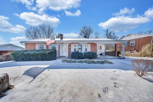 single story home featuring a carport