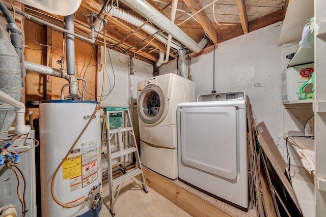 laundry area with washer and clothes dryer and gas water heater