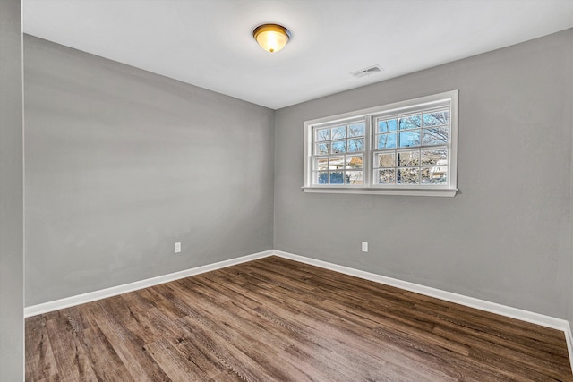 empty room featuring dark hardwood / wood-style floors