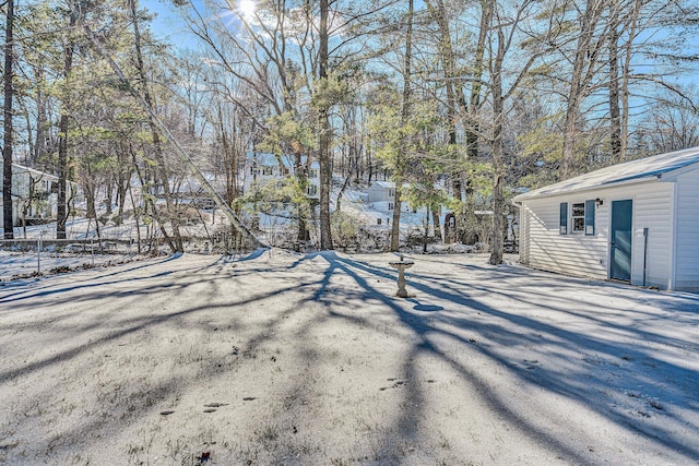 view of yard layered in snow