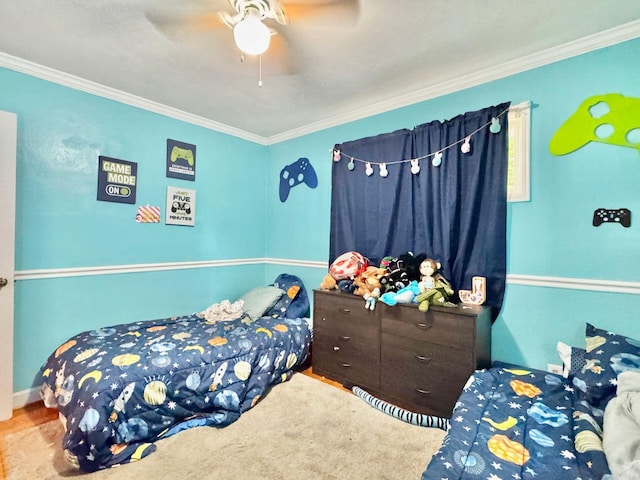 carpeted bedroom with ceiling fan and ornamental molding