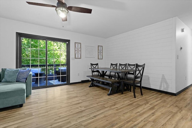 dining room with ceiling fan and light hardwood / wood-style flooring