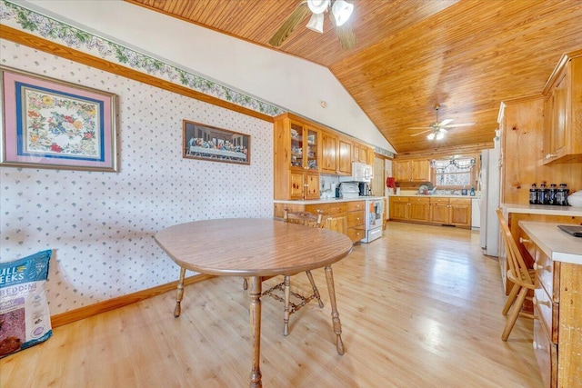 dining room with ceiling fan, lofted ceiling, light hardwood / wood-style flooring, and wooden ceiling