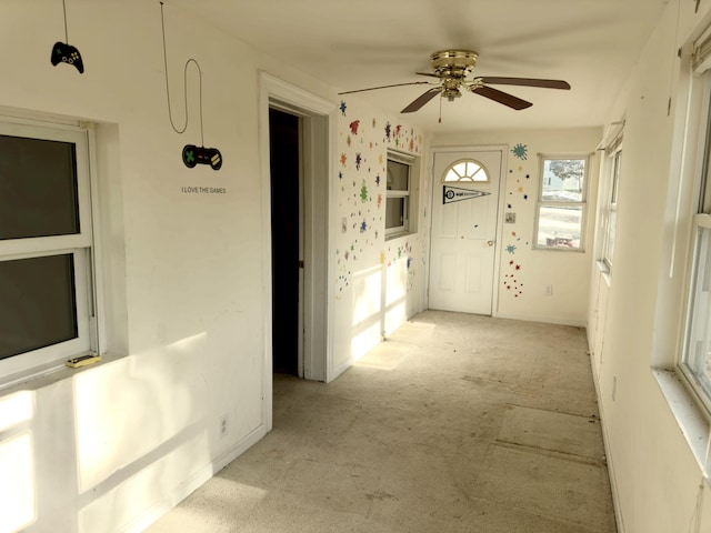 interior space featuring ceiling fan