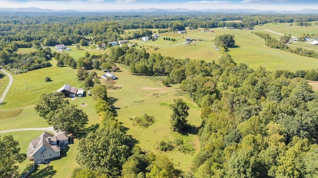 birds eye view of property with a rural view