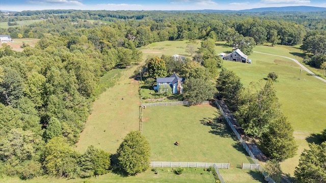 birds eye view of property with a rural view