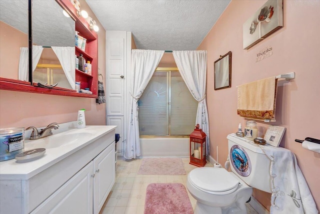 full bathroom featuring vanity, toilet, shower / bathtub combination with curtain, and a textured ceiling