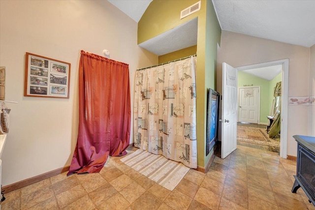 bathroom with vaulted ceiling