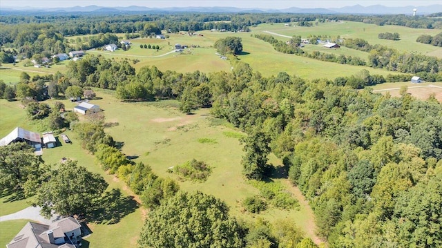 birds eye view of property featuring a rural view