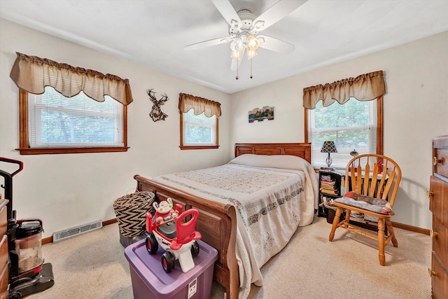 carpeted bedroom featuring ceiling fan