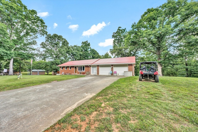 view of front of home featuring a front lawn and a garage