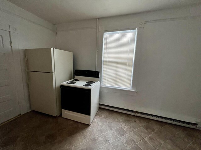 kitchen with white appliances and a healthy amount of sunlight