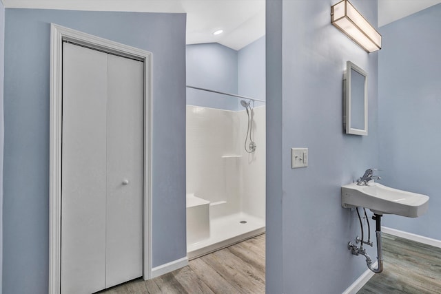 306 Carey Ave, Salem, VA 24153 - bathroom featuring hardwood / wood-style floors, a shower, and sink