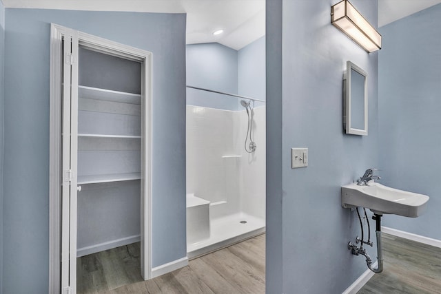 306 Carey Ave, Salem, VA 24153 - bathroom with a shower, wood-type flooring, and sink
