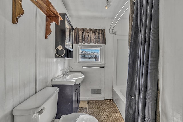 full bathroom featuring vanity, toilet, and shower / bathtub combination with curtain