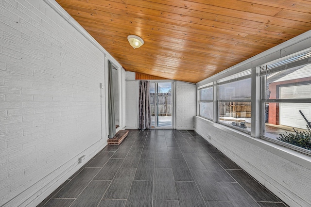 unfurnished sunroom featuring lofted ceiling and wood ceiling