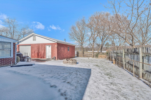 exterior space with a garage and an outdoor structure