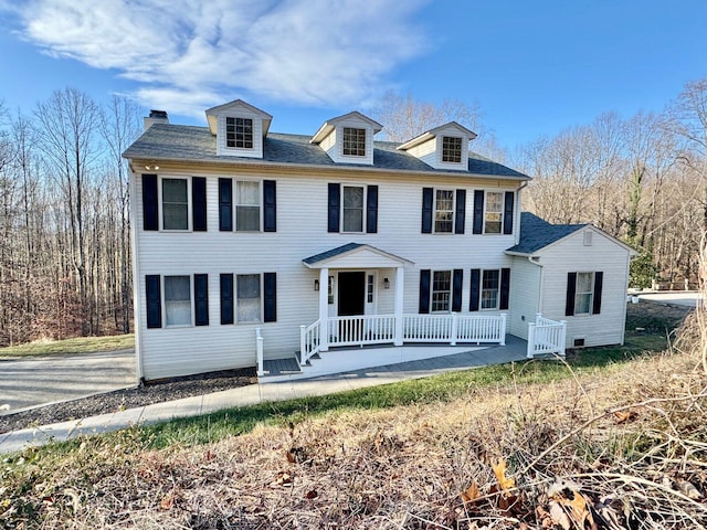 colonial home featuring a porch