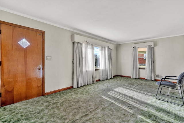 entryway featuring carpet floors and ornamental molding