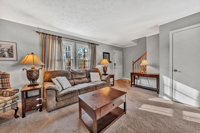 carpeted living room featuring a textured ceiling