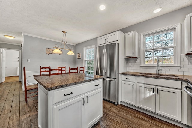 kitchen featuring white cabinets, dark hardwood / wood-style flooring, sink, and stainless steel appliances