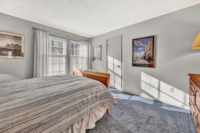 carpeted bedroom featuring a textured ceiling and crown molding
