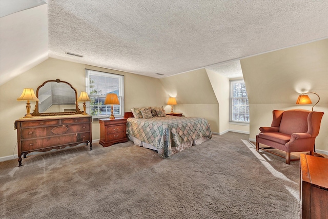 bedroom with visible vents, a textured ceiling, carpet, and lofted ceiling