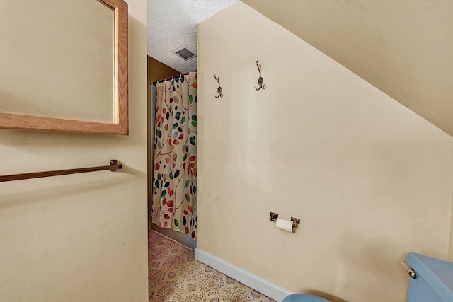 bathroom with a textured ceiling