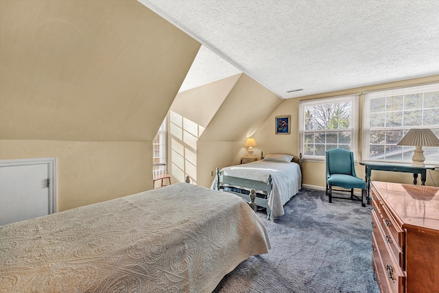 carpeted bedroom featuring a textured ceiling and vaulted ceiling