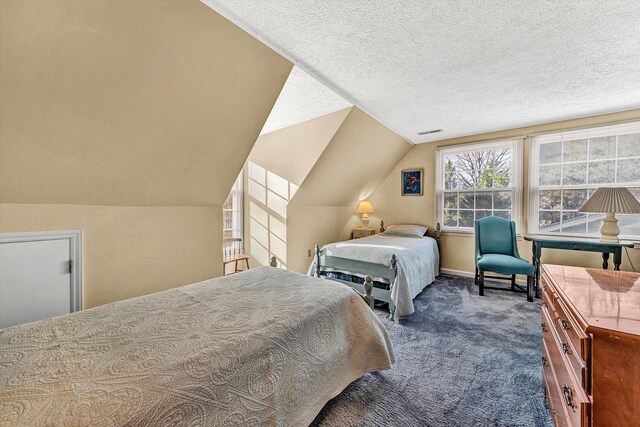 carpeted bedroom featuring baseboards, visible vents, a textured ceiling, and lofted ceiling