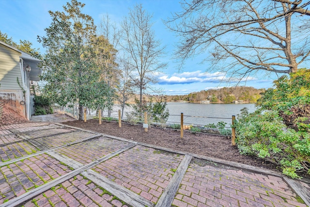 view of patio featuring a water view