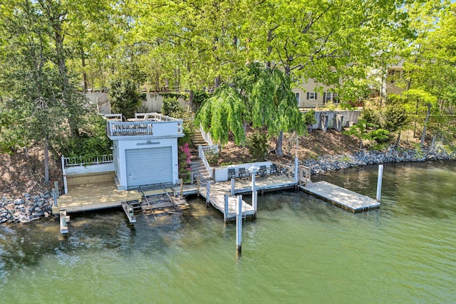 dock area featuring a deck with water view and stairs