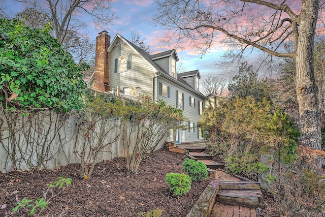 view of property exterior at dusk