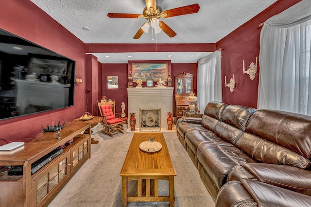 living room featuring a textured ceiling, ceiling fan, and light carpet