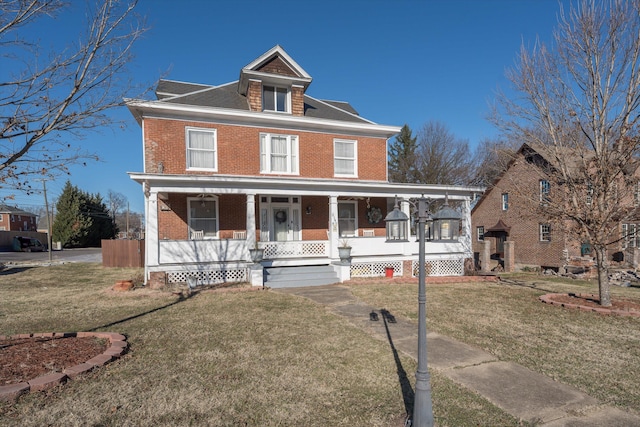 view of front facade featuring a porch and a front yard