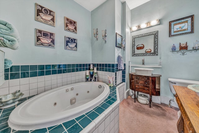 bathroom with a relaxing tiled tub and vanity