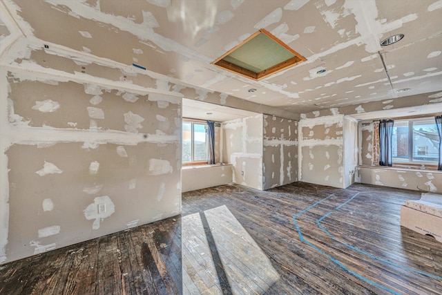 unfurnished room featuring dark wood-type flooring