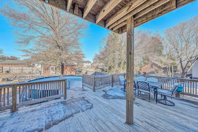 deck featuring a fenced in pool