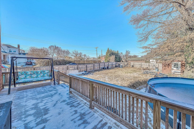 wooden terrace with a pool