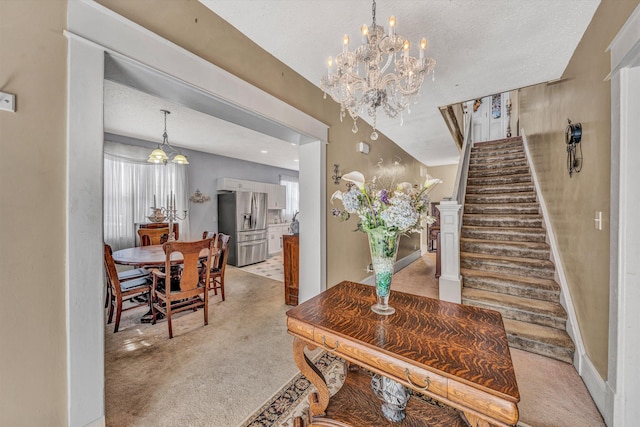 interior space with an inviting chandelier and light carpet