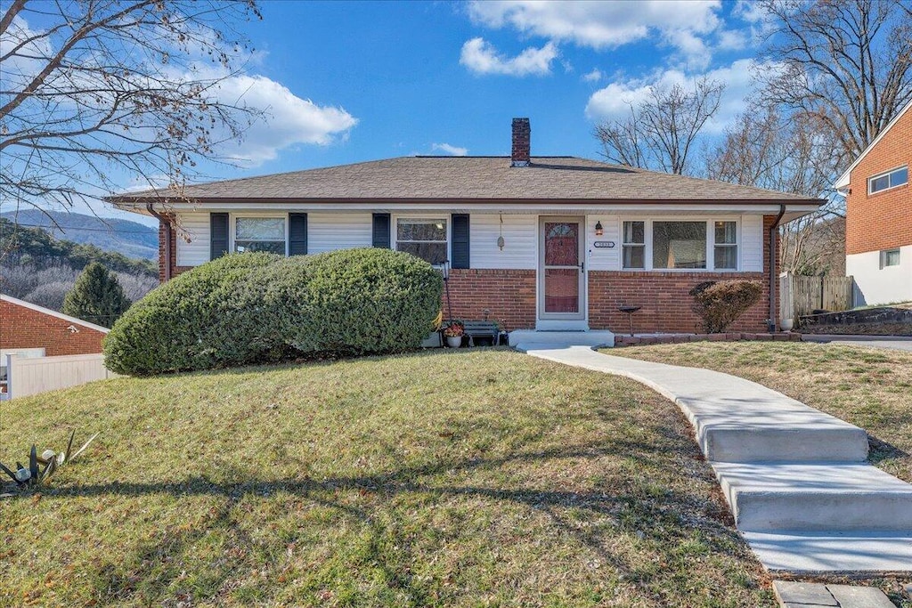 ranch-style house with a front lawn