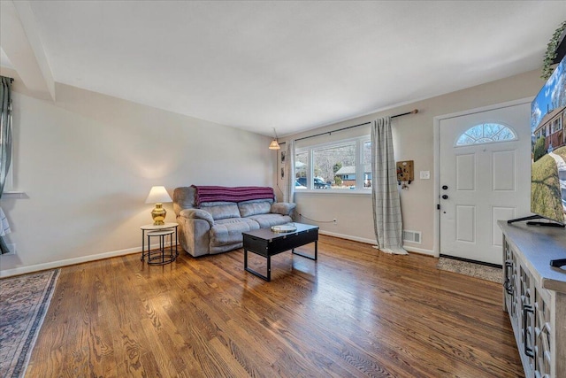 living room with dark hardwood / wood-style floors