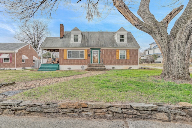 new england style home with a front lawn