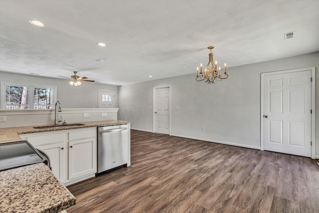 kitchen featuring visible vents, white cabinets, hanging light fixtures, stainless steel dishwasher, and a sink