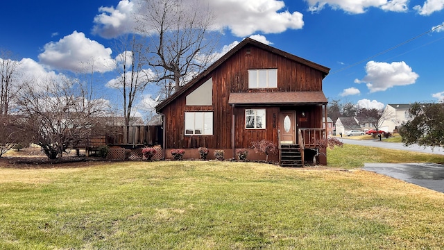 back of house featuring a yard